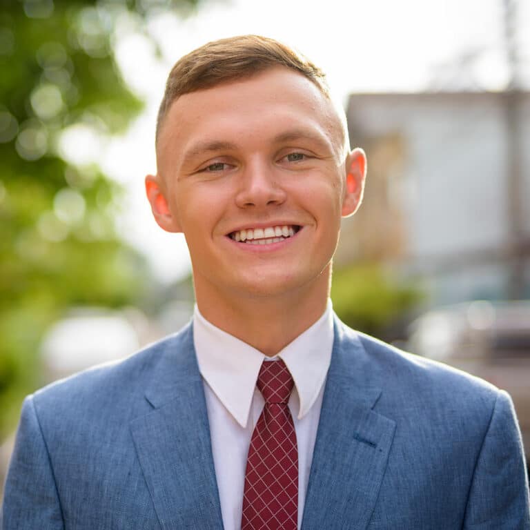 portrait-of-young-businessman-in-the-streets-outdo-ECXN8FS.jpg